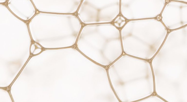 Detailansicht einer hellen beigen Waben-Struktur