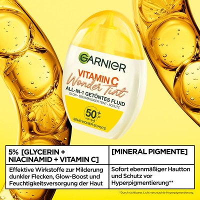 Garnier Wonder Tint All-In-One Getöntes Fluid mit 5% Glycerin, Niacinamid und Vitamin C, für Glow Boost und Milderung von dunklen Flecken in Einem. Hier vor einem wisschenschaftlichen Garnier Hintergrund abgebildet.