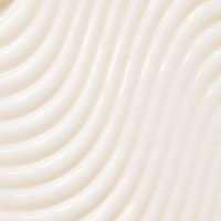 CremigeTexturder Wahre Schätze Leave-In-Creme Honig Schätzein einem Cremeweiß Ton