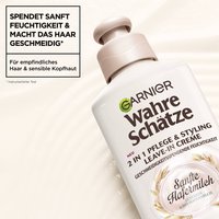 DieWahre SchätzeLeave-In-Creme sanfte Hafermilchist im Vordergrund, im Hintergrund ist die Cremige Textur des Produktes